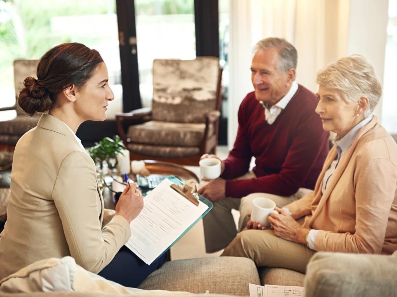A settlement funding provider working on a residential life settlements job — mid-task, hands, tools and the work itself in sharp focus, the rest of the space softly out of focus